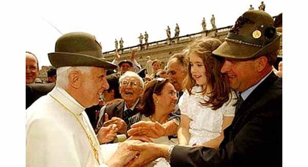 Benedict wearing a Tyrolean hat amidst a crowd